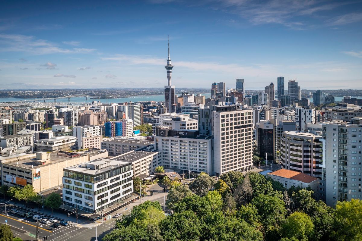 Auckland New Zealand — Sky Tower and Waitematā Harbour with sailing yachts, City of Sails
