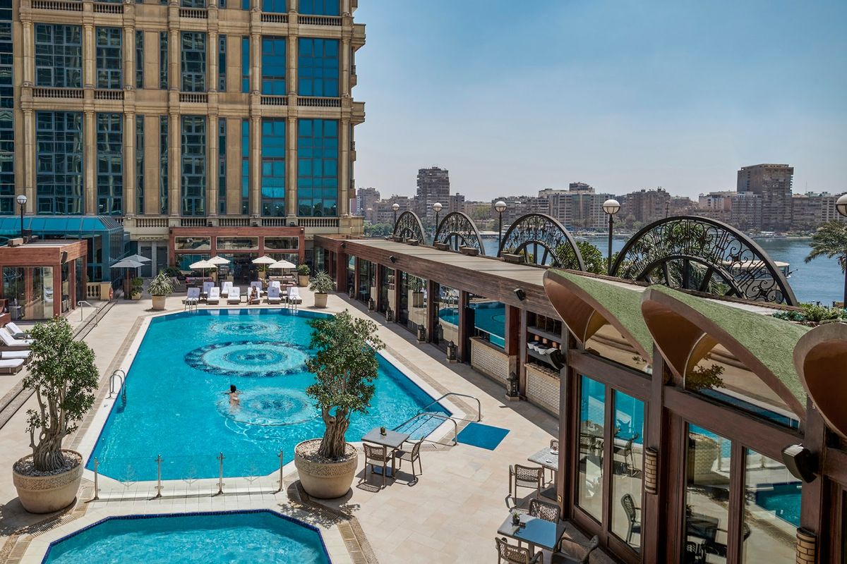 Cairo Egypt — Pyramids of Giza with Sphinx and Nile River with city skyline ancient capital