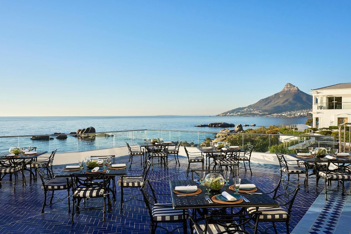 Cape Town Table Mountain at sunset — V&A Waterfront harbour with iconic flat-topped mountain backdrop, South Africa