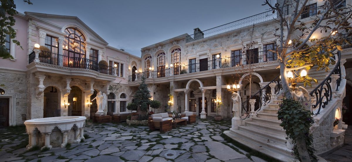Kayakapi Premium Caves Cappadocia — luxury all suite cave hotel with 38 suites restored from Ürgüp ancient stone village