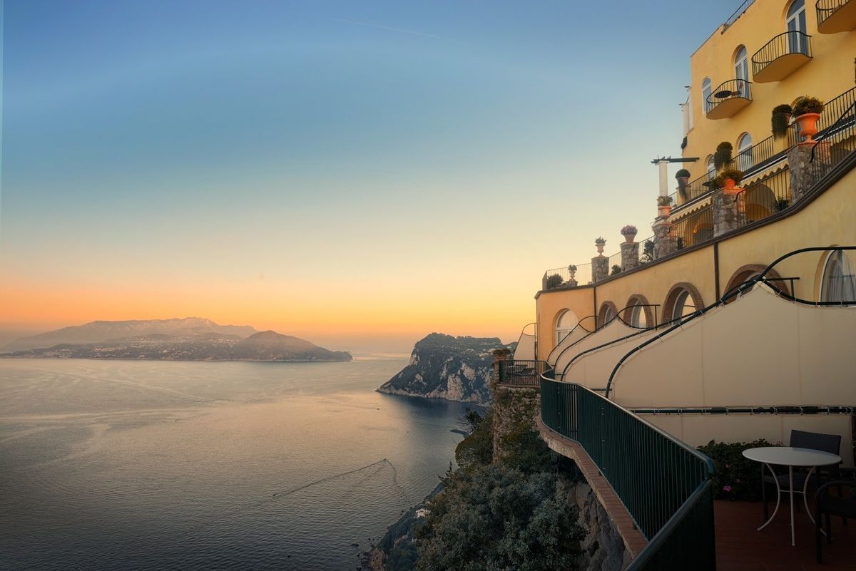 Capri island view from Anacapri — Faraglioni rock stacks rising from the Tyrrhenian Sea, southern Italy