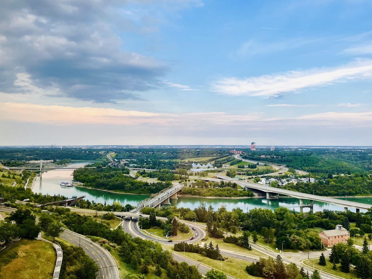 Edmonton skyline at dusk — High Level Bridge and downtown towers above the North Saskatchewan River valley, Alberta