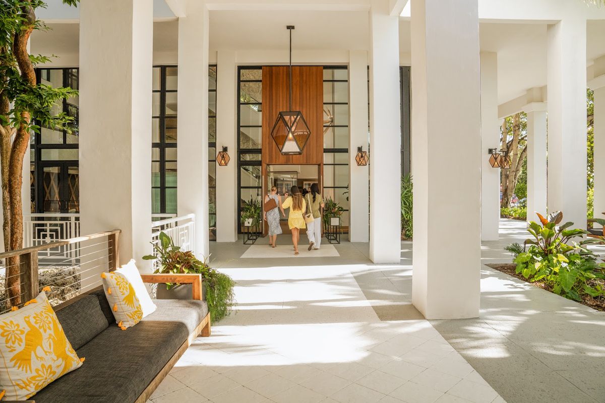 Tranquility Bay Beachfront Hotel Marathon — beach houses with white-railing porches on private sand beach