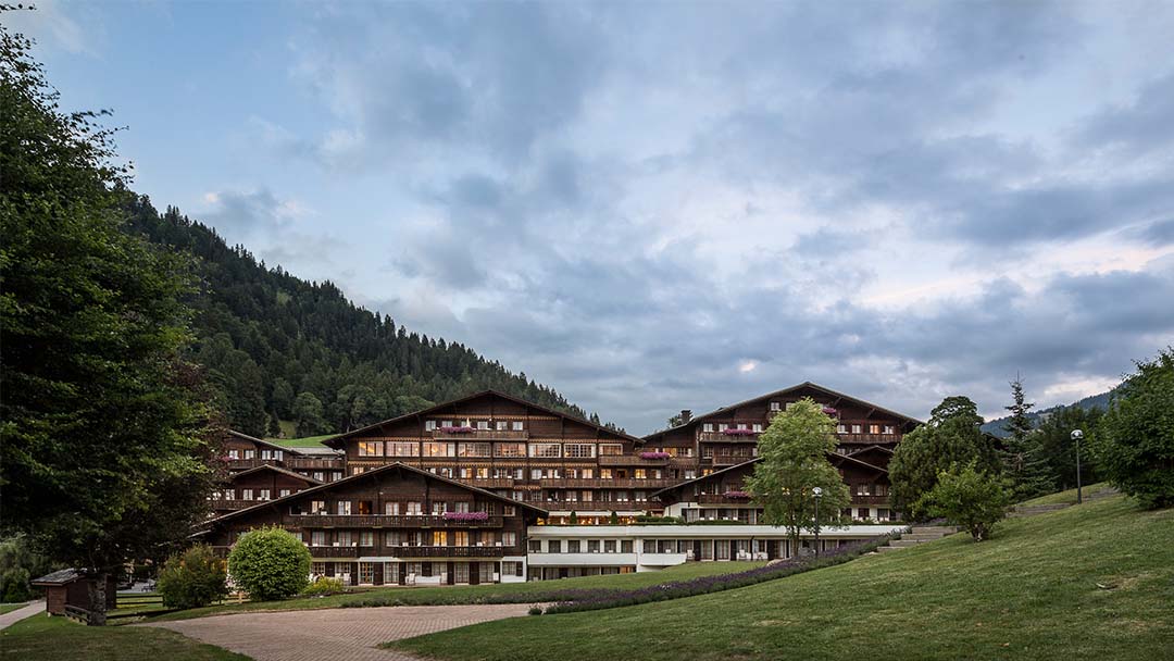 HUUS Gstaad — contemporary alpine design hotel above Saanen with valley panorama