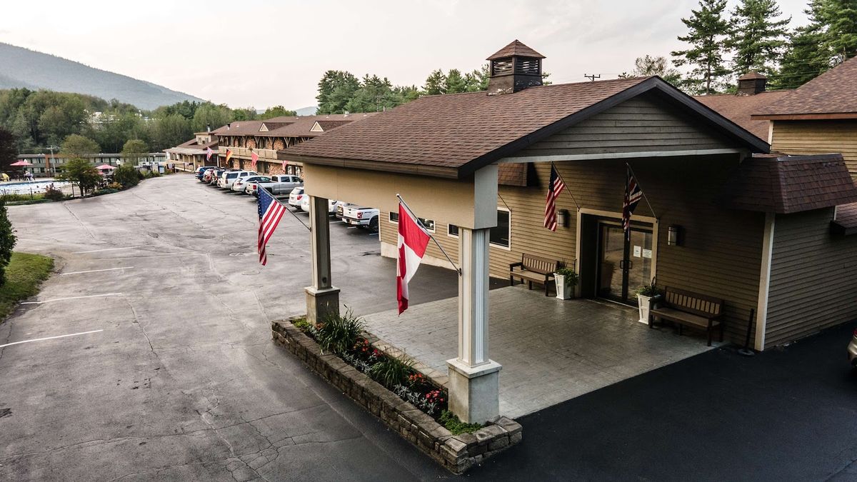 Lake George, New York — sweeping Adirondack mountain view across the calm waters of the Queen of American Lakes