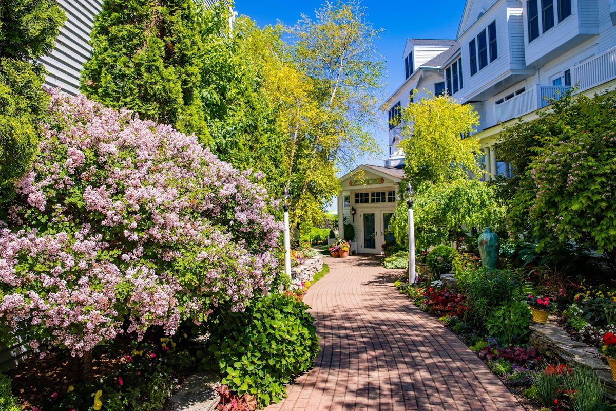The Island House Hotel Mackinac Island — 1852 historic hotel on Main Street with white veranda overlooking the harbour