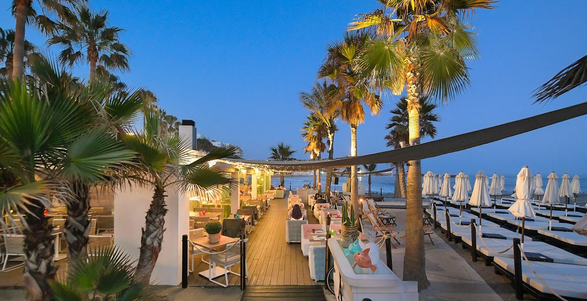 Marbella Spain — Costa del Sol beach with Sierra Blanca mountains, Andalucía Mediterranean luxury coast