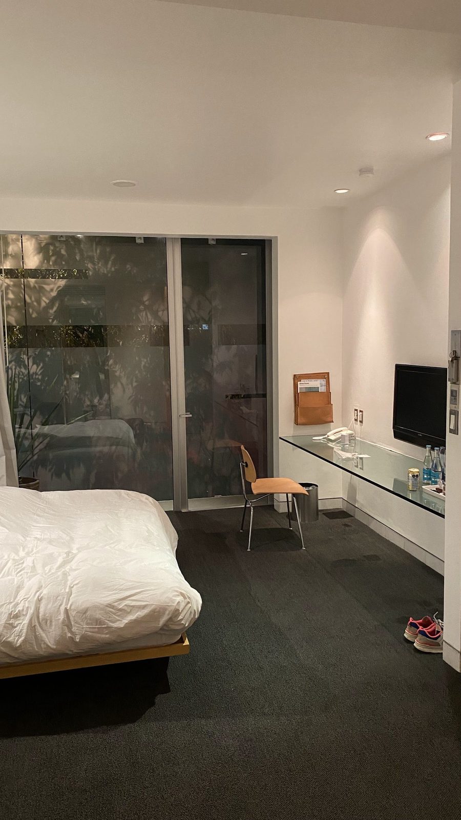 Hotel Habita Mexico City — 36-key 2000 Ten Arquitectos Polanco minimalist boutique with frosted-glass skin enclosing 1950s apartment building