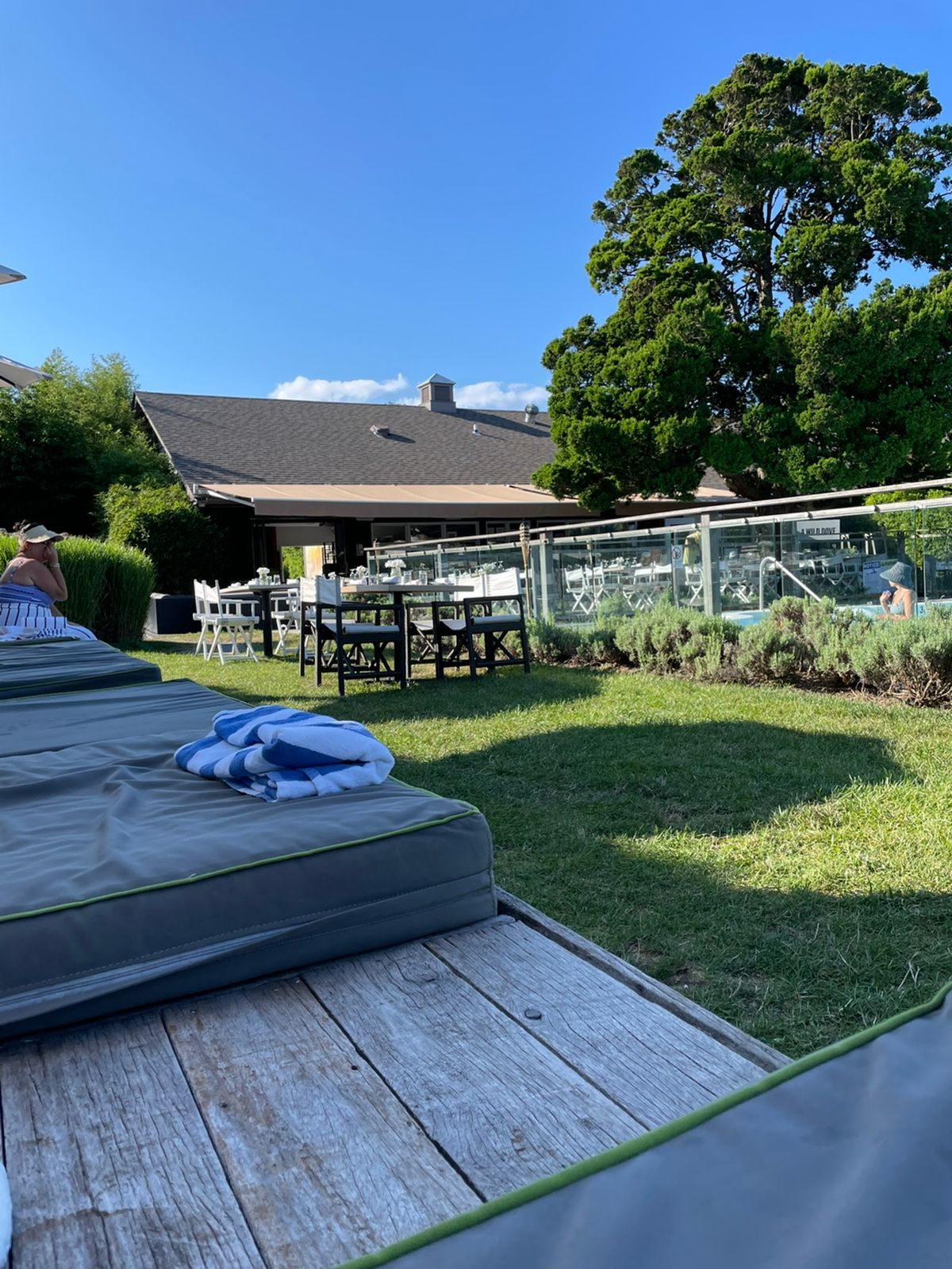 The Crows Nest Montauk — boutique hillside inn overlooking Lake Montauk, dinner terrace at sunset
