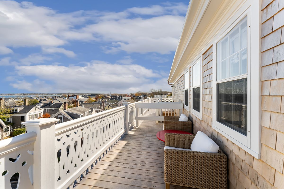 The Cottages and Lofts at the Boat Basin — gray-shingled waterfront cottages on a Nantucket wharf