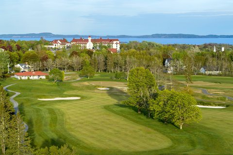 Saint Andrews by-the-Sea New Brunswick — Algonquin Resort Tudor castle and Bay of Fundy coastline at golden hour