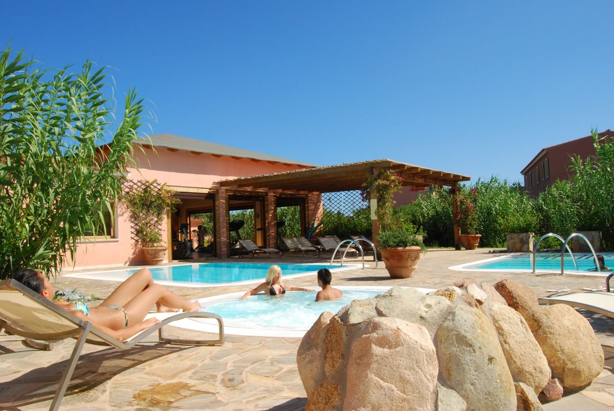 Resort Valle dell'Erica Thalasso Spa Santa Teresa di Gallura — granite cliffs and beachfront five star resort facing Corsica
