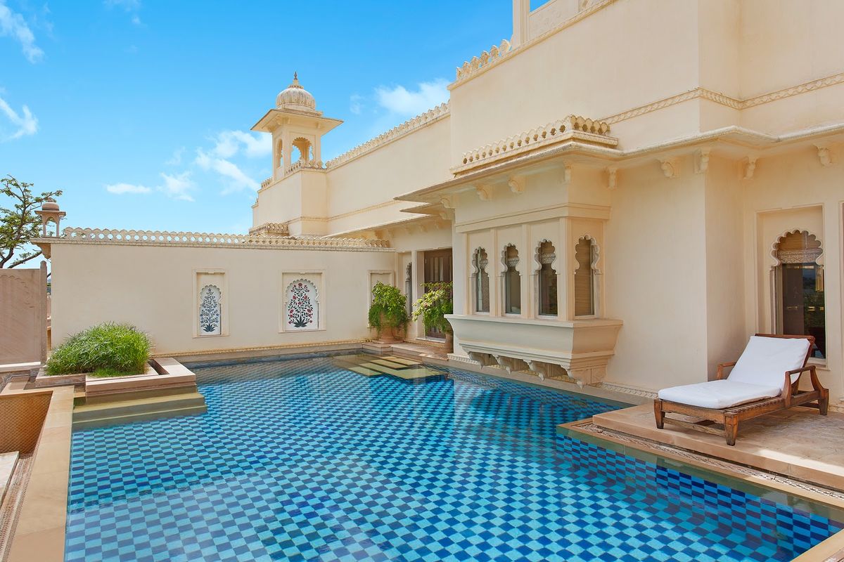 The Leela Palace Udaipur — lakefront five star hotel with 80 rooms, pools facing Lake Pichola and palace-inspired architecture