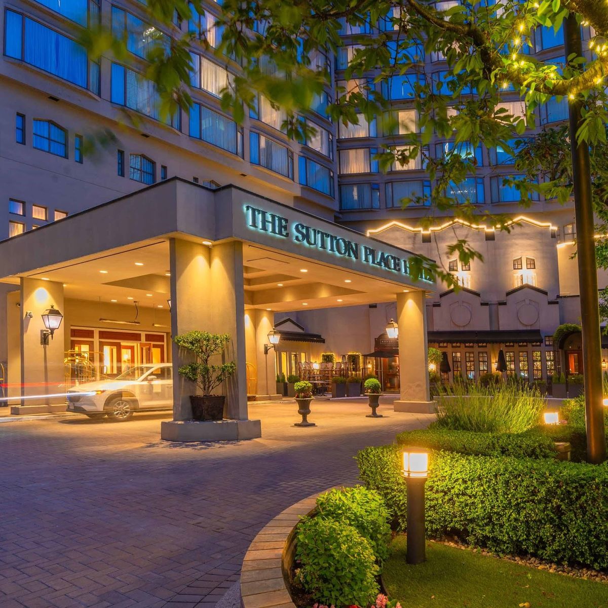 Sutton Place Hotel Vancouver — established luxury hotel on Burrard Street, downtown Vancouver, façade at evening