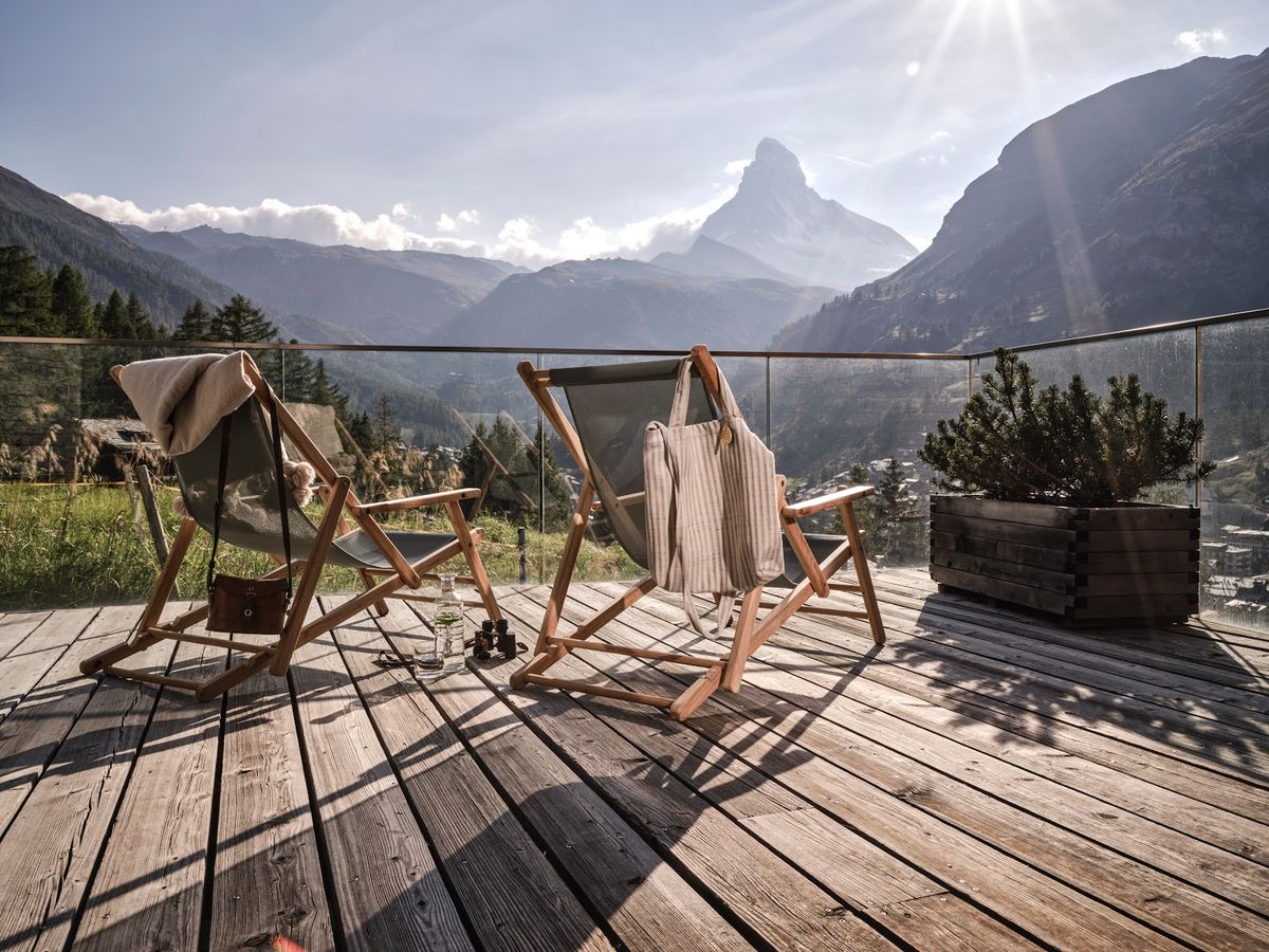 Zermatt Switzerland — Matterhorn pyramid peak above traditional Swiss Alpine village, car-free Valais resort
